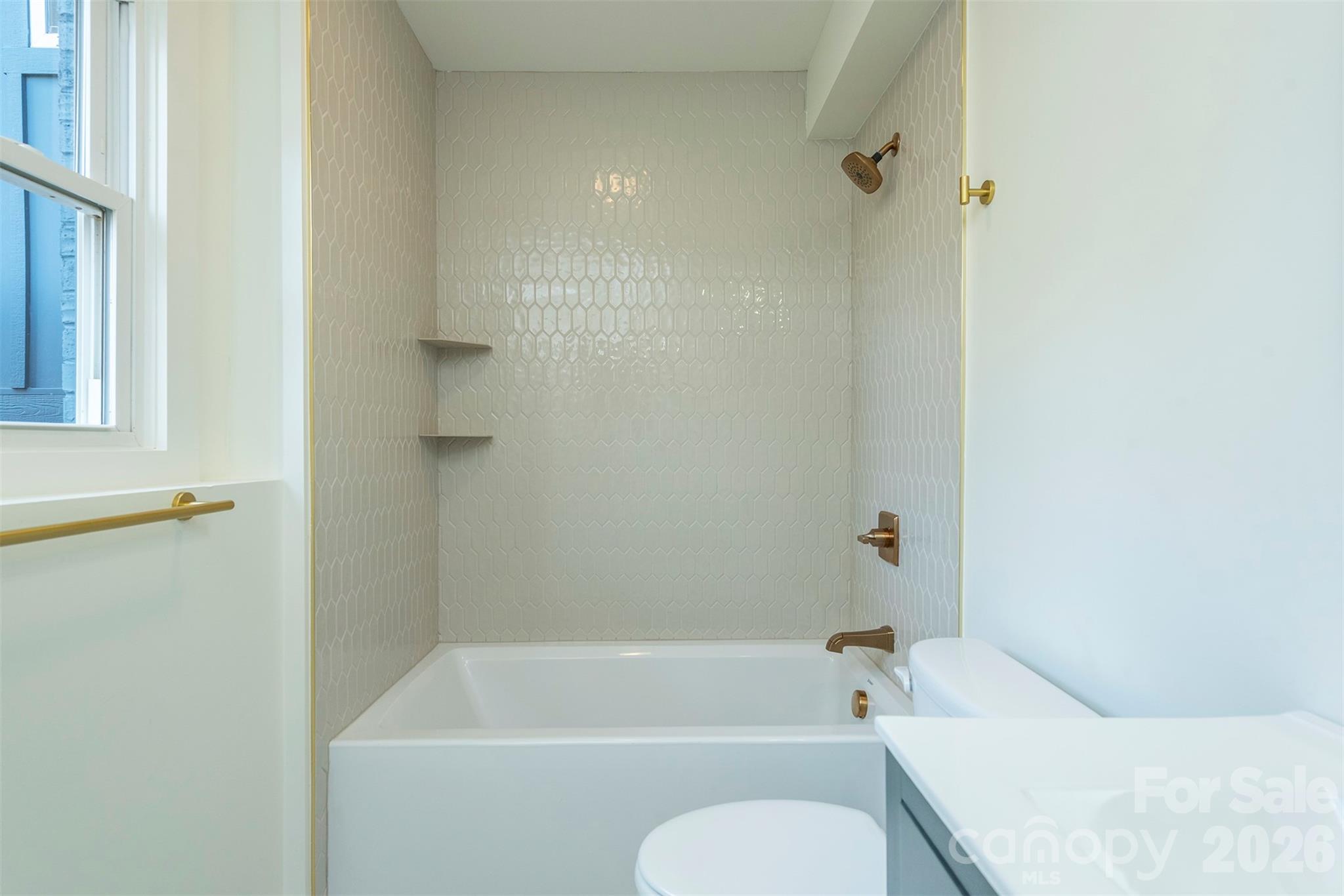 524 Pineland Road Hendersonville, NC 28792 - Photo 31 of 36 a bathroom with a toilet and a bath tub