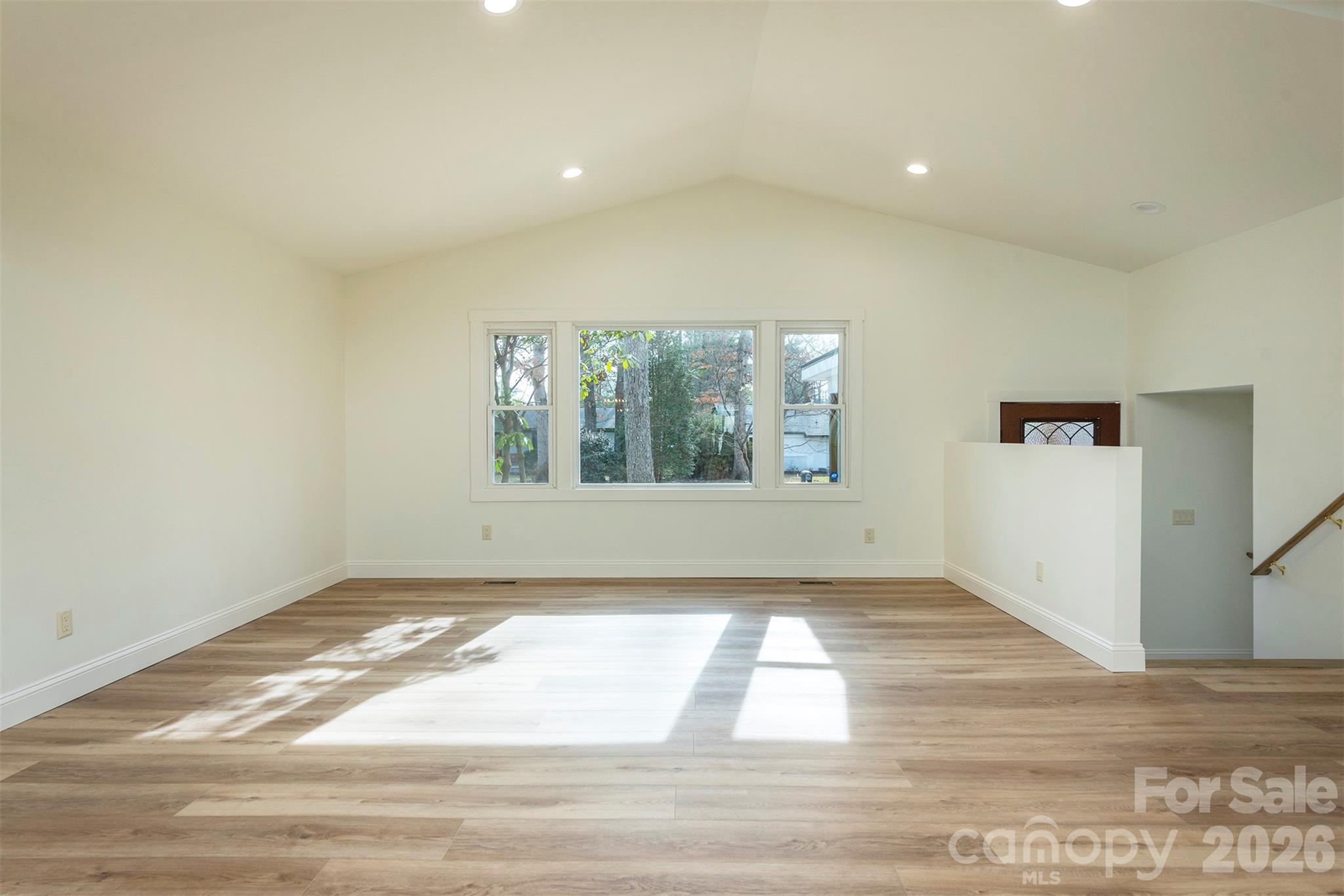 524 Pineland Road Hendersonville, NC 28792 - Photo 5 of 36 a view of an empty room and window