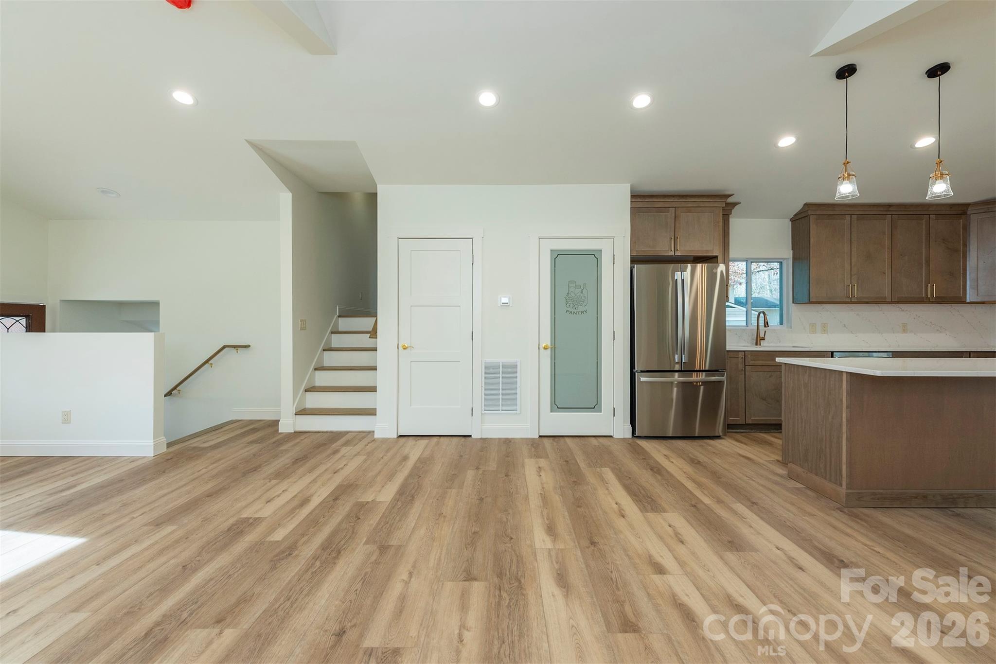 524 Pineland Road Hendersonville, NC 28792 - Photo 7 of 36 a large kitchen with a refrigerator a sink and a oven