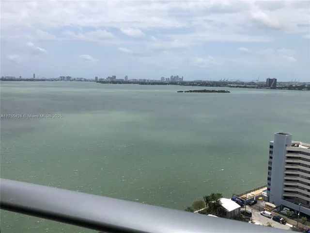 a view of a lake from a balcony