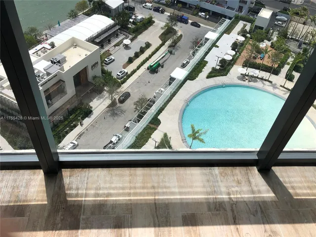 a bathroom with a shower and a sink