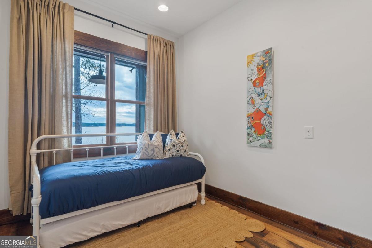 4096 Big Water E Road Sparta, GA 31087 - Photo 20 of 70 a bedroom with a bed and a window