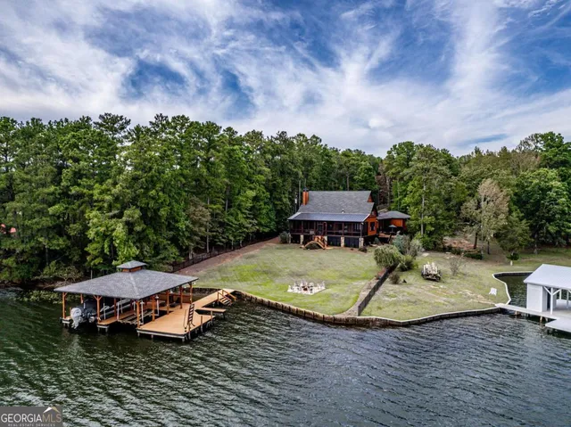 a living room with fireplace furniture and a flat screen tv