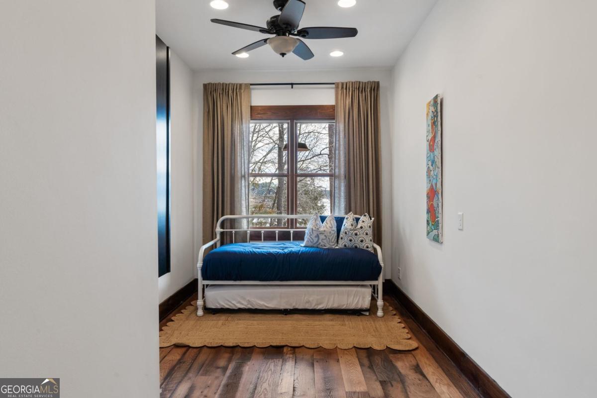 4096 Big Water E Road Sparta, GA 31087 - Photo 21 of 70 a bedroom with a bed and a window