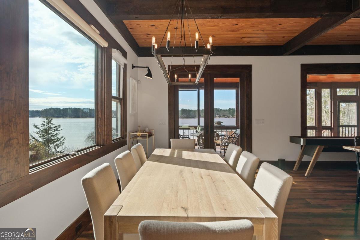 4096 Big Water E Road Sparta, GA 31087 - Photo 36 of 70 a view of a dining room with furniture window and wooden floor