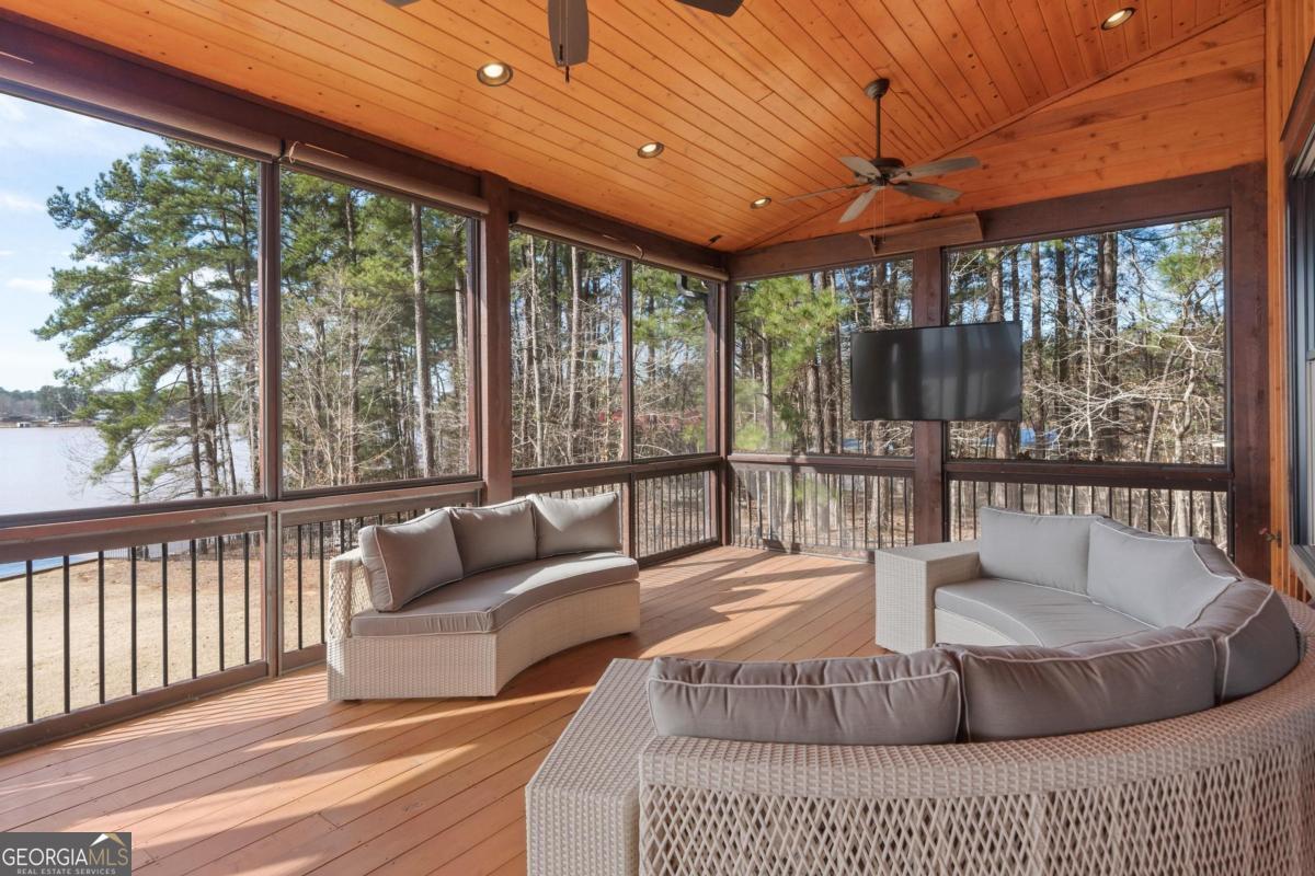 4096 Big Water E Road Sparta, GA 31087 - Photo 40 of 70 a living room with large windows