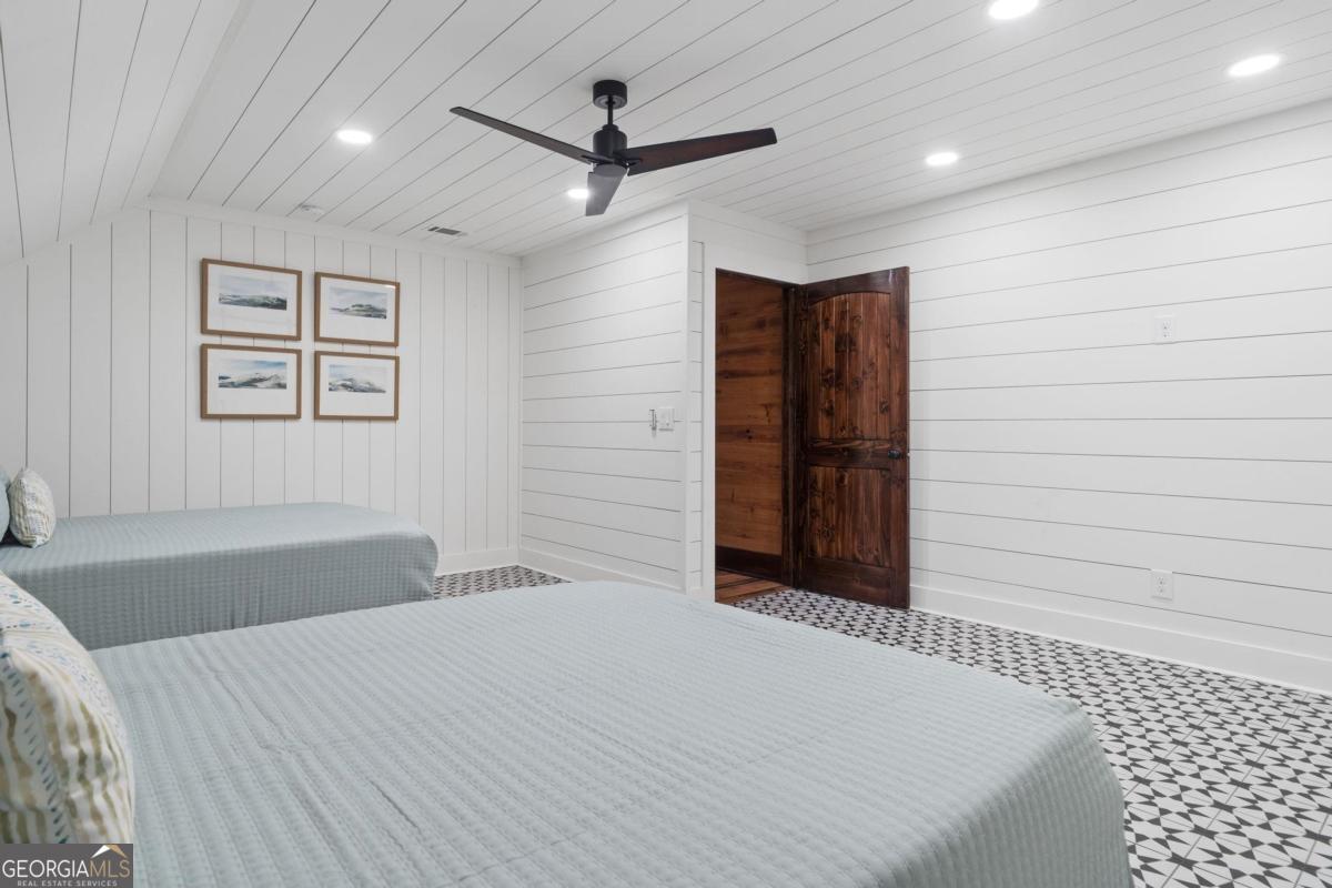 4096 Big Water E Road Sparta, GA 31087 - Photo 47 of 70 a bedroom with a bed and a walk in closet