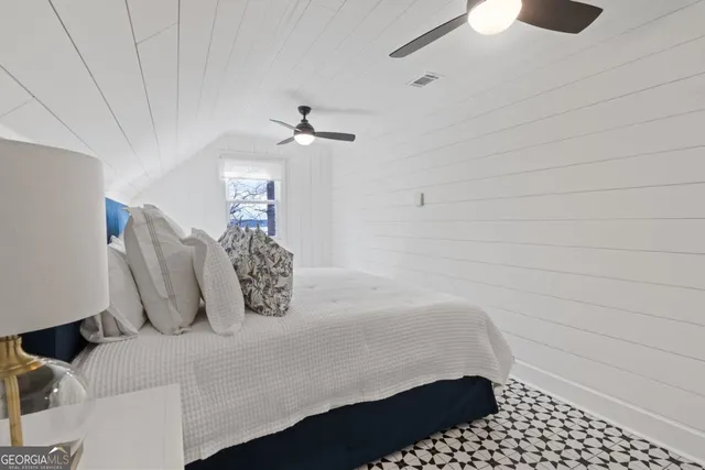 a view of a house with yard and sitting area