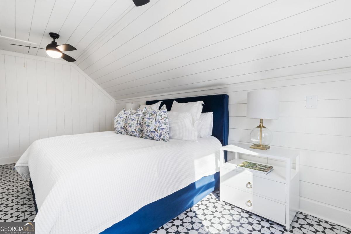 4096 Big Water E Road Sparta, GA 31087 - Photo 50 of 70 a bedroom with a bed and a dresser