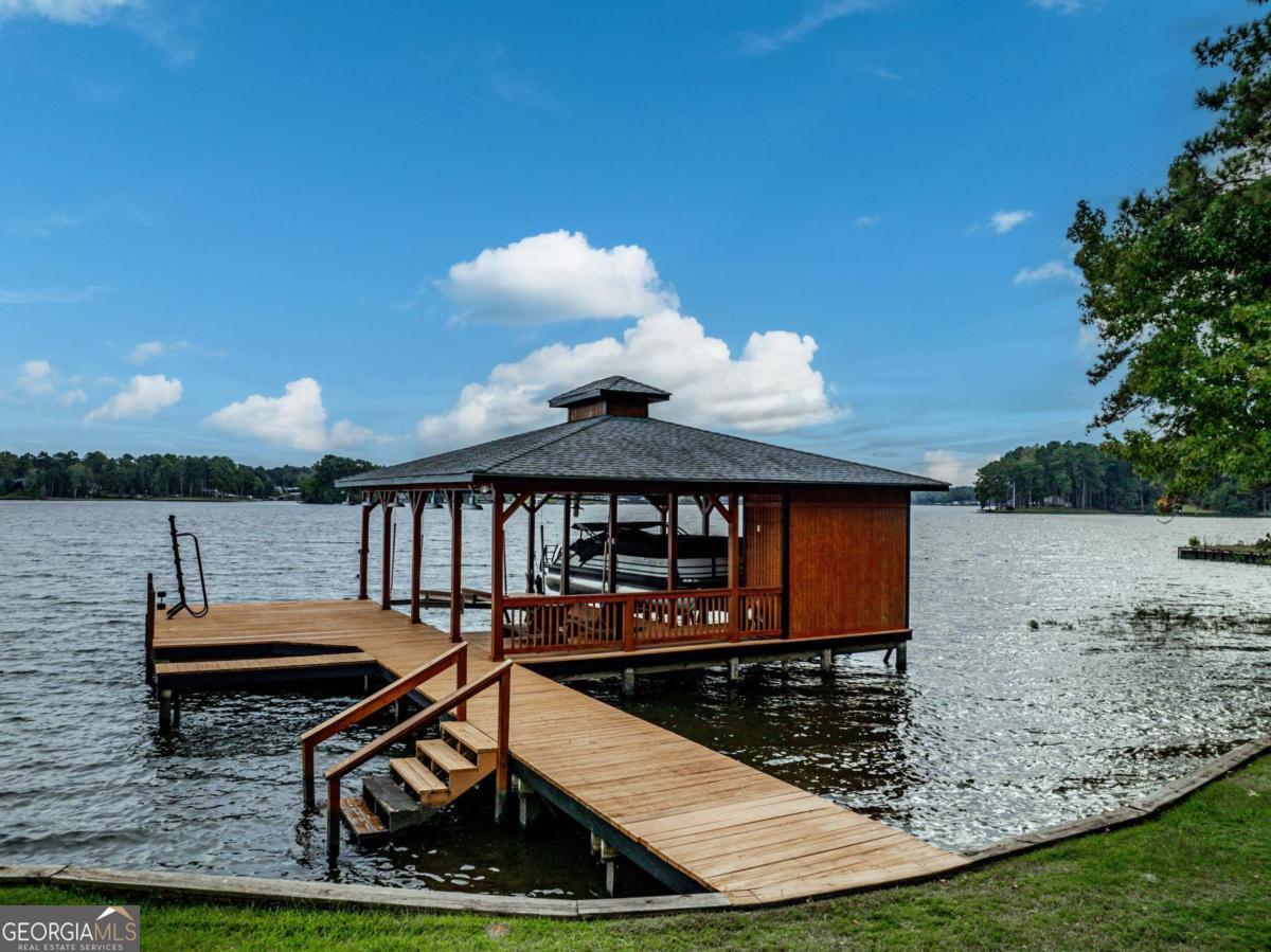 4096 Big Water E Road Sparta, GA 31087 - Photo 58 of 70 a view of a house with backyard and sitting area