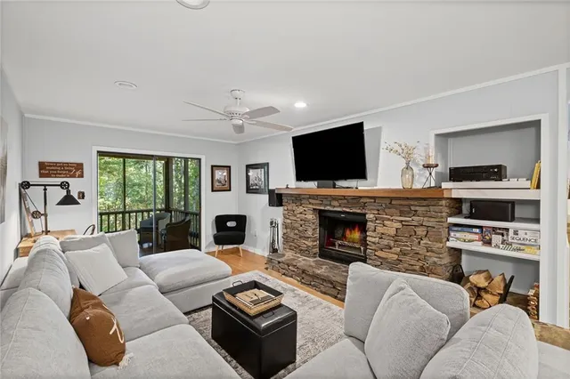 a living room with fireplace furniture and a flat screen tv