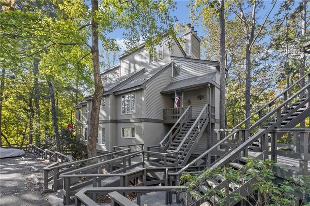 a view of a balcony with wooden floor and stairs