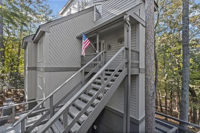 a backyard of a house with large trees