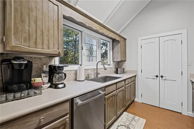 a kitchen with a sink and cabinets