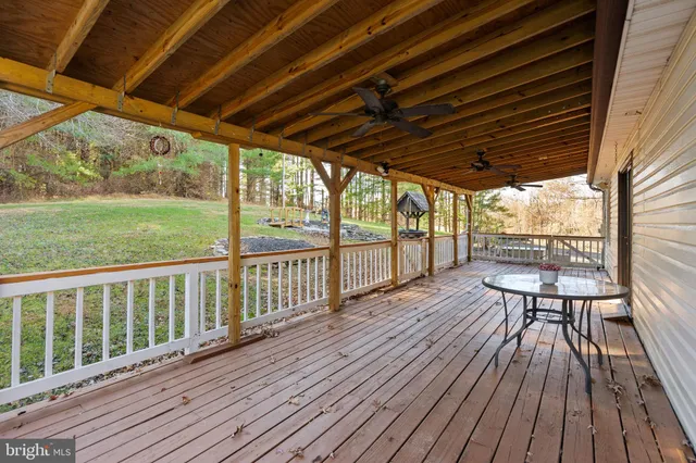 a view of porch with wooden floor
