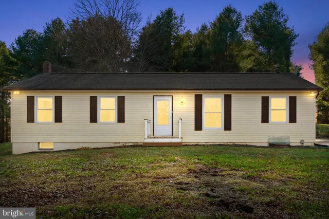 a house with yard in front of it