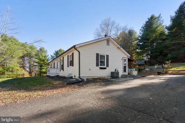 a view of a porch with wooden floor and fence