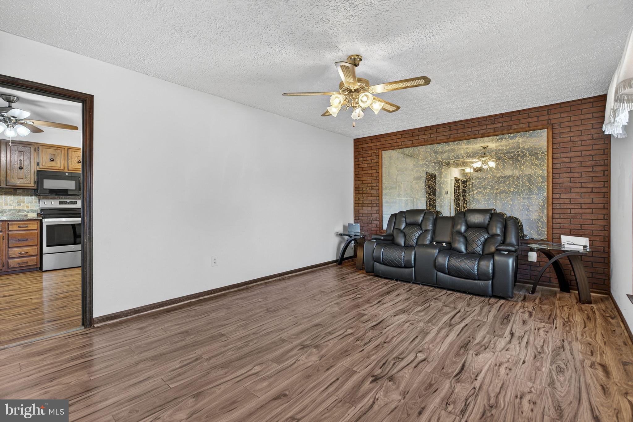 148 Viewtown Road Amissville, VA 20106 - Photo 31 of 56 a living room with furniture and wooden floor