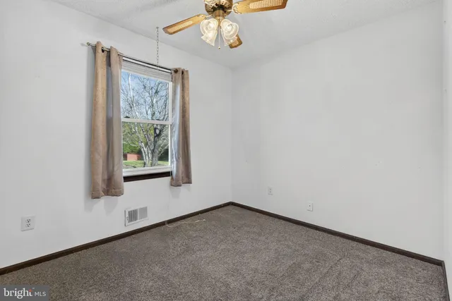 a bedroom with a bed and a walk in closet