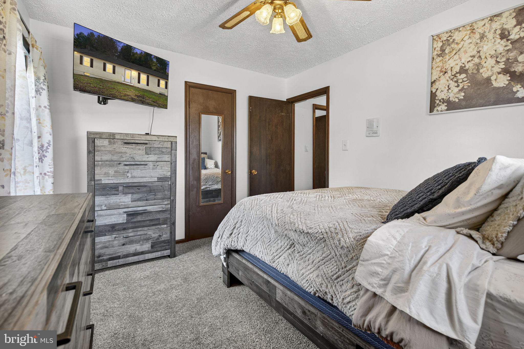 148 Viewtown Road Amissville, VA 20106 - Photo 38 of 56 a bedroom with a bed and a walk in closet