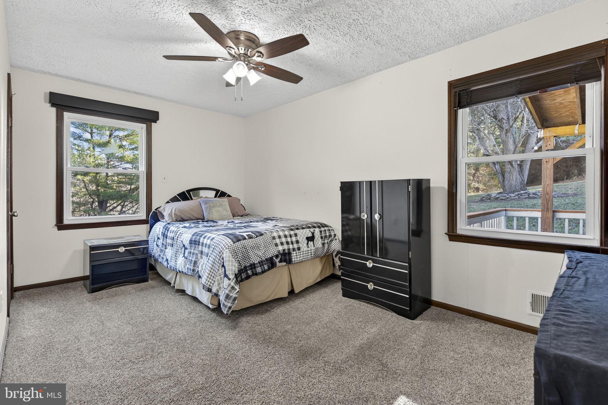 148 Viewtown Road Amissville, VA 20106 - Photo 40 of 56 a bedroom with a bed and a large window