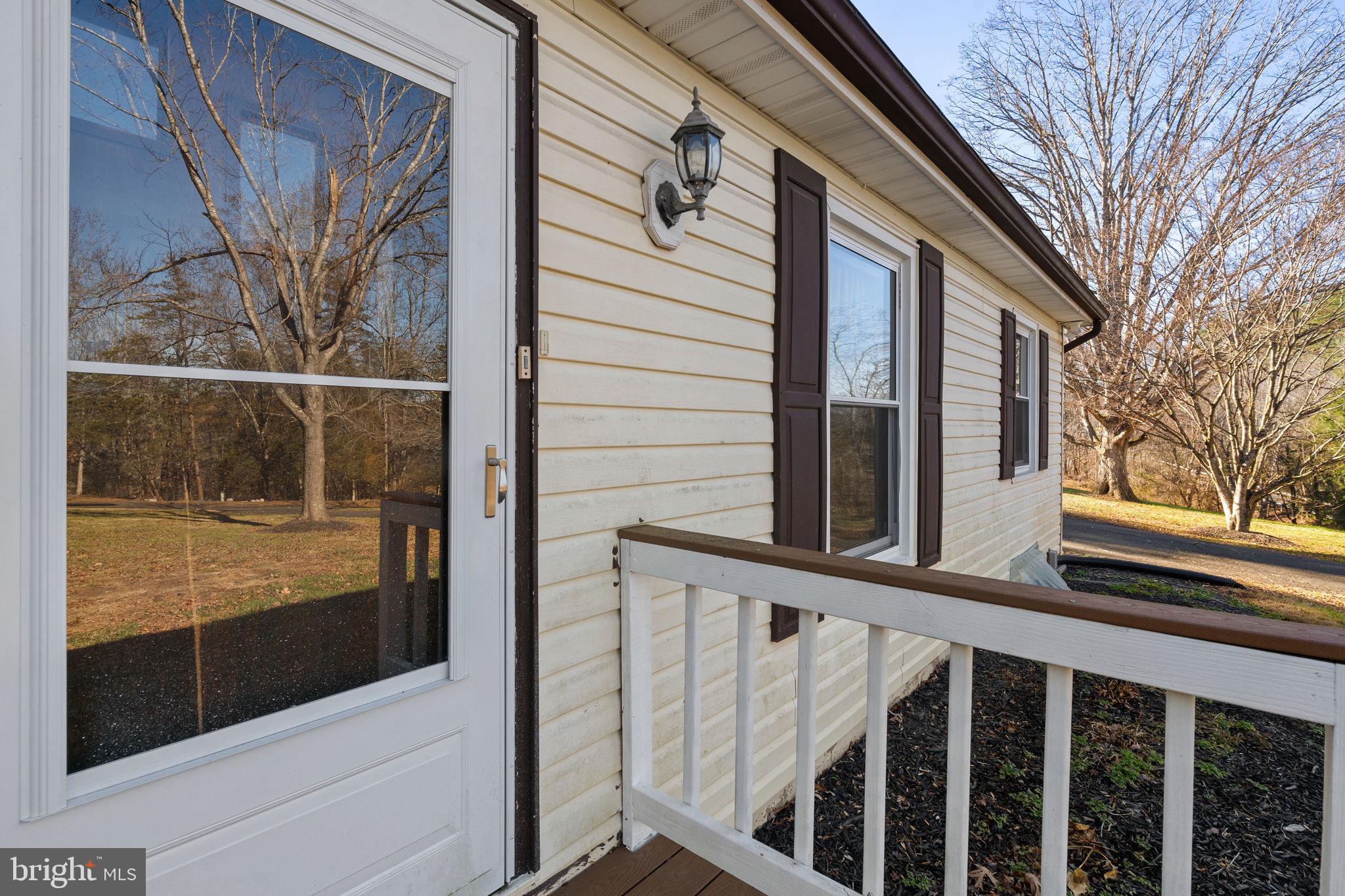 148 Viewtown Road Amissville, VA 20106 - Photo 4 of 56 a view of a porch with wooden floor and fence