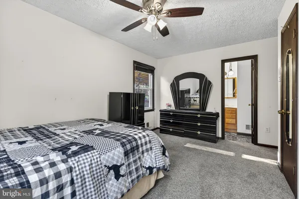 a kitchen with stainless steel appliances granite countertop a sink a stove cabinets and wooden floor