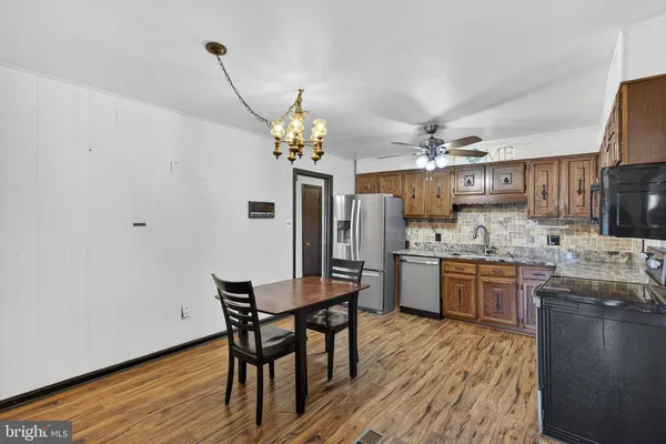 a white toilet sitting next to a shower