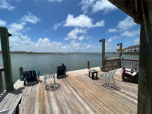 a view of a roof deck with wooden fence