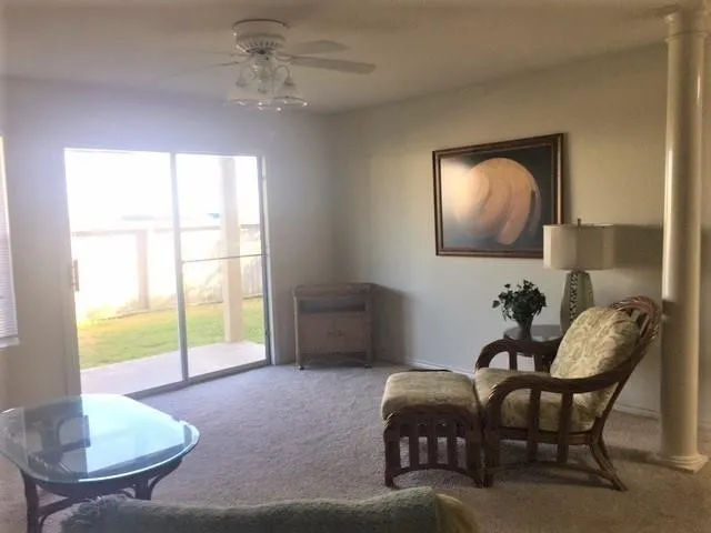 a livingroom with furniture and window