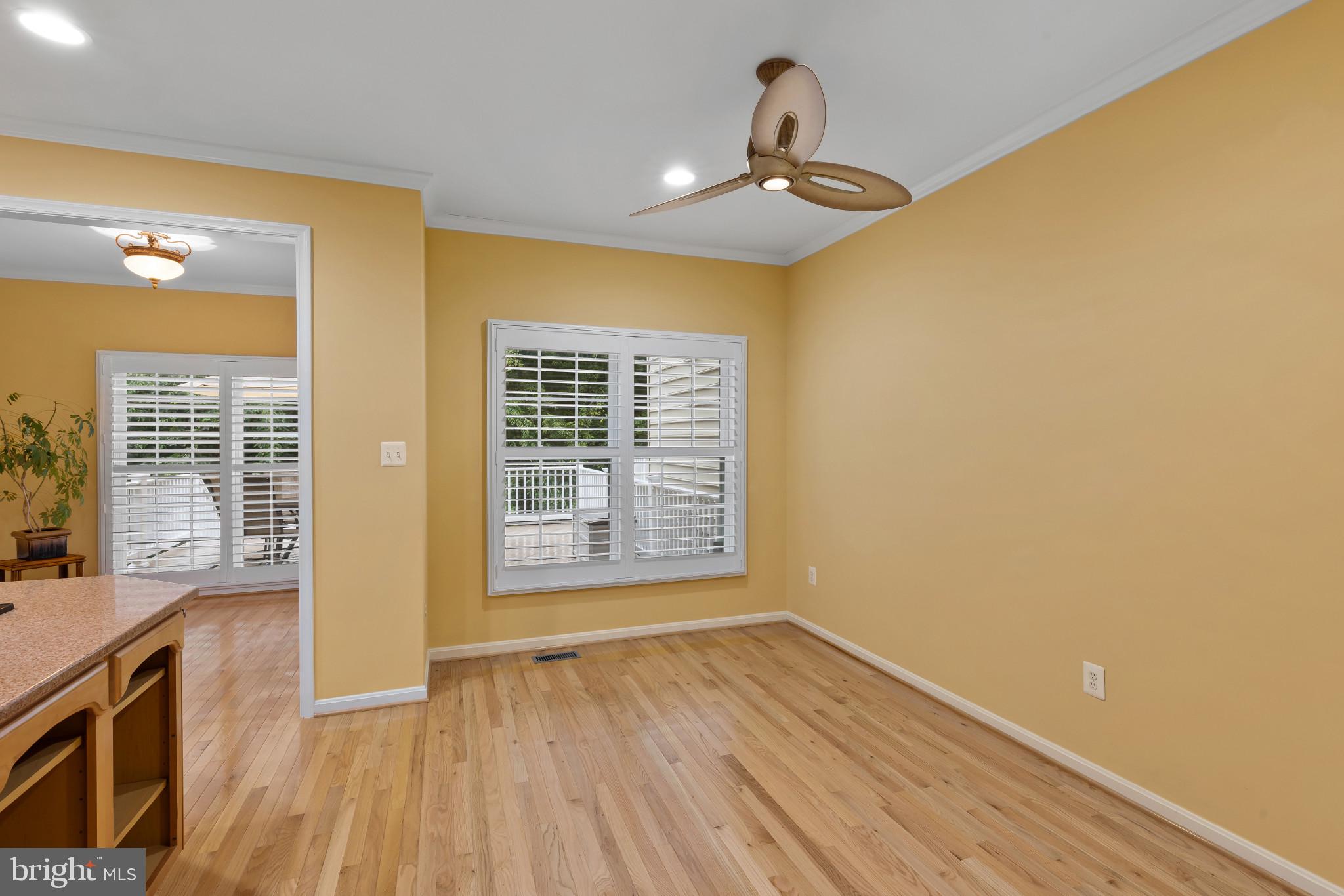 2433 Killarney Terrace Odenton, MD 21113 - Photo 13 of 48 a view of an empty room with a window and wooden floor