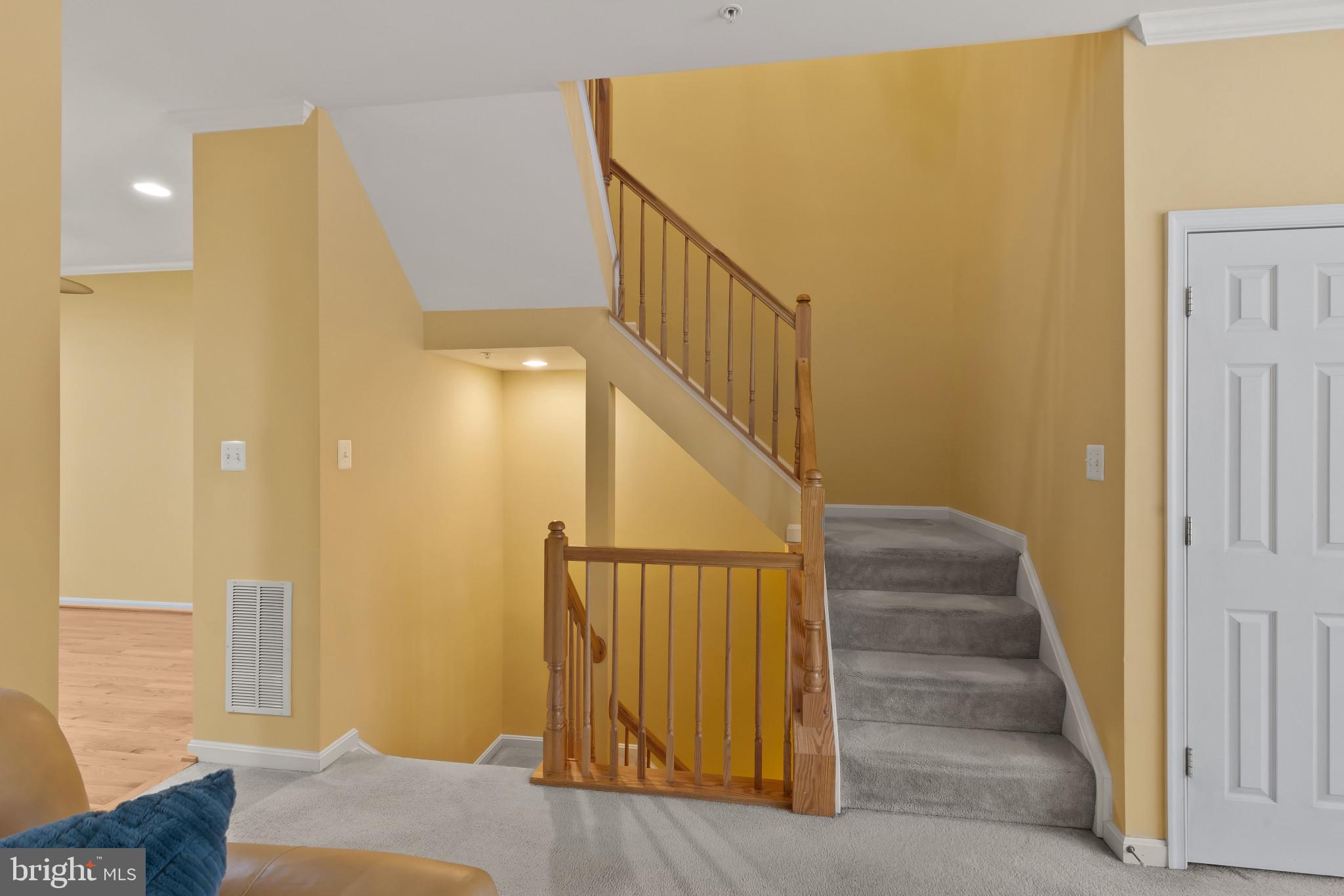 2433 Killarney Terrace Odenton, MD 21113 - Photo 19 of 48 a view of a hallway with wooden floor and staircase