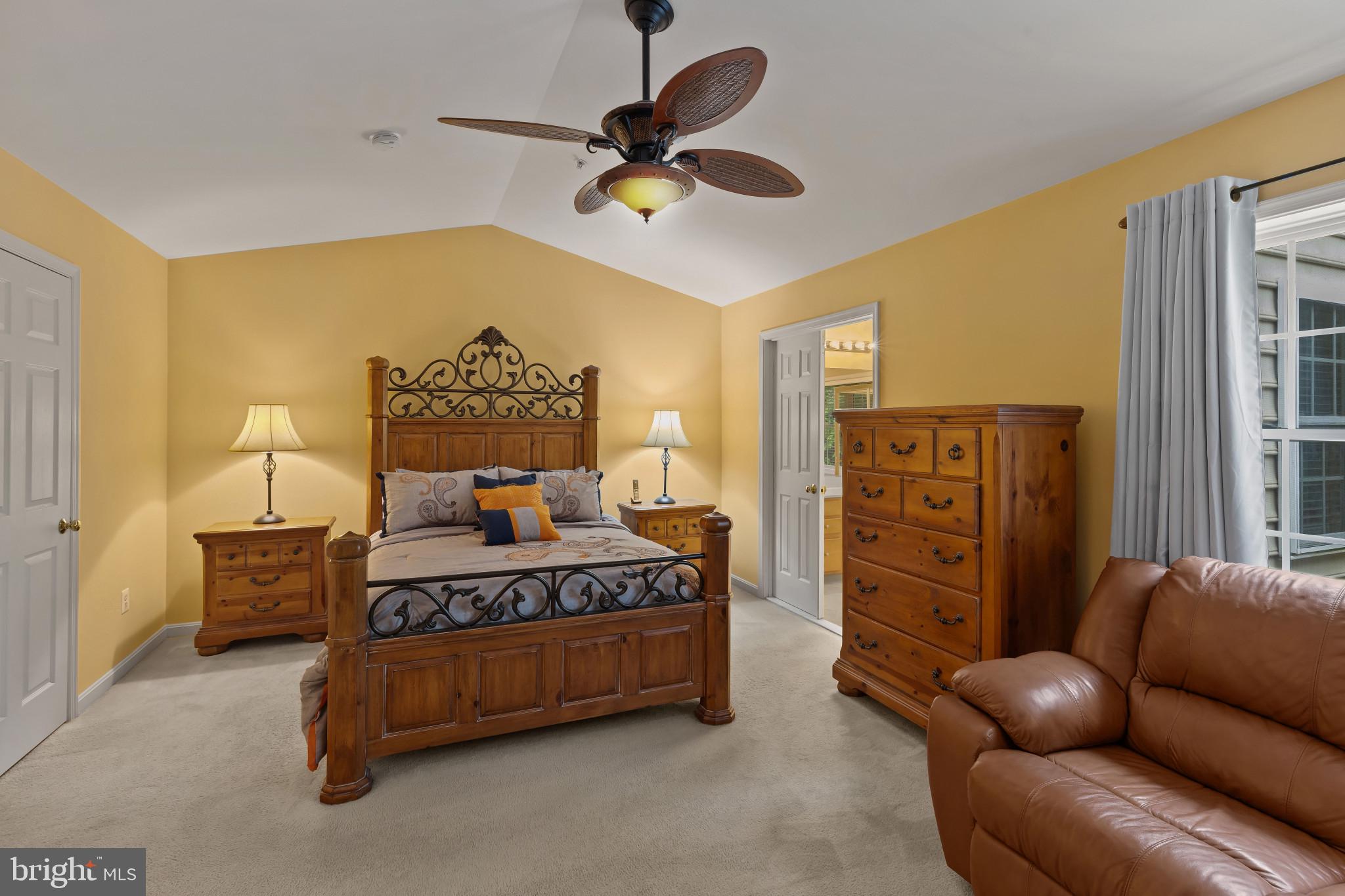 2433 Killarney Terrace Odenton, MD 21113 - Photo 21 of 48 a spacious bedroom with a bed and ceiling fan