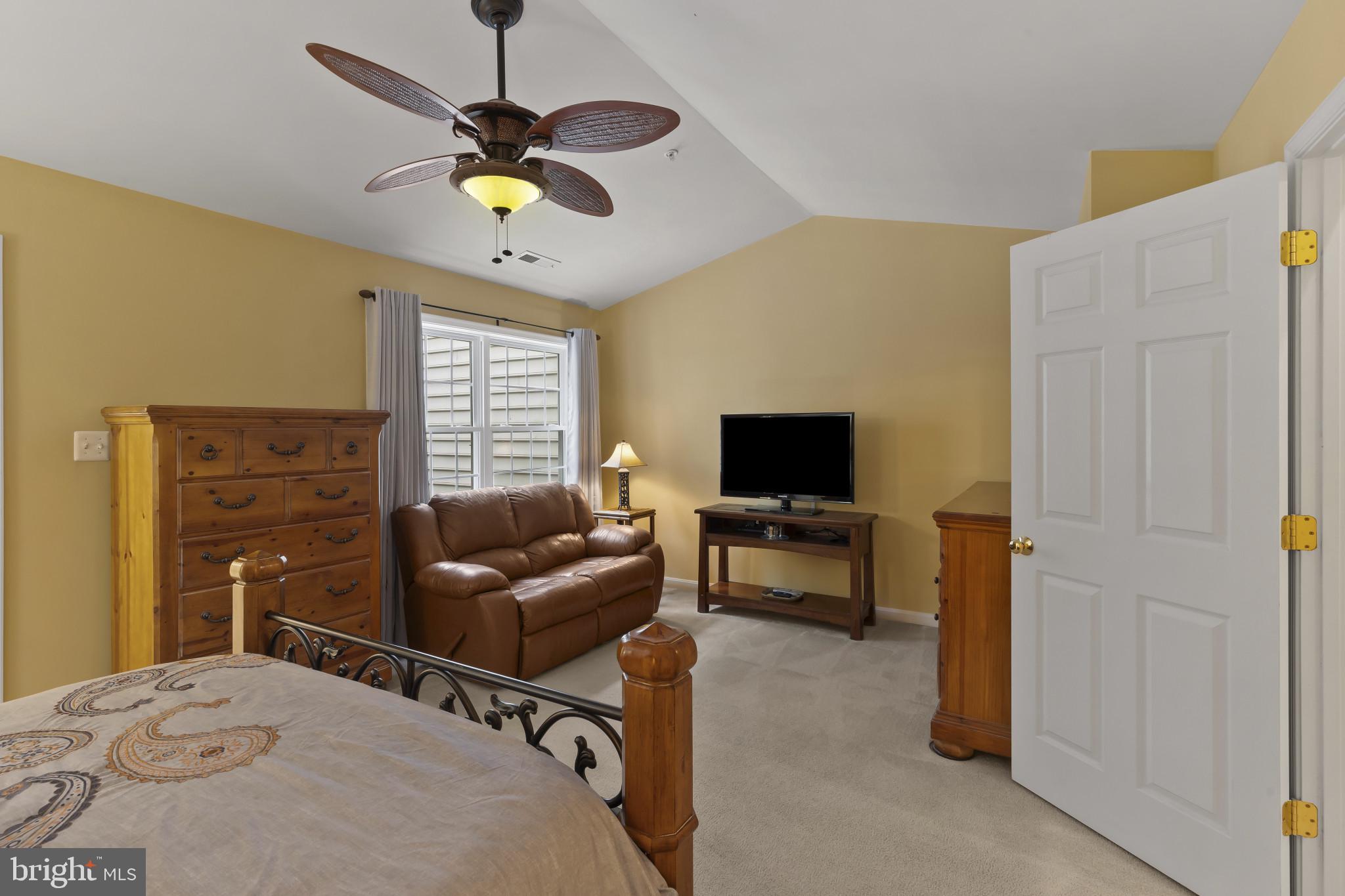 2433 Killarney Terrace Odenton, MD 21113 - Photo 23 of 48 a living room with furniture and a flat screen tv