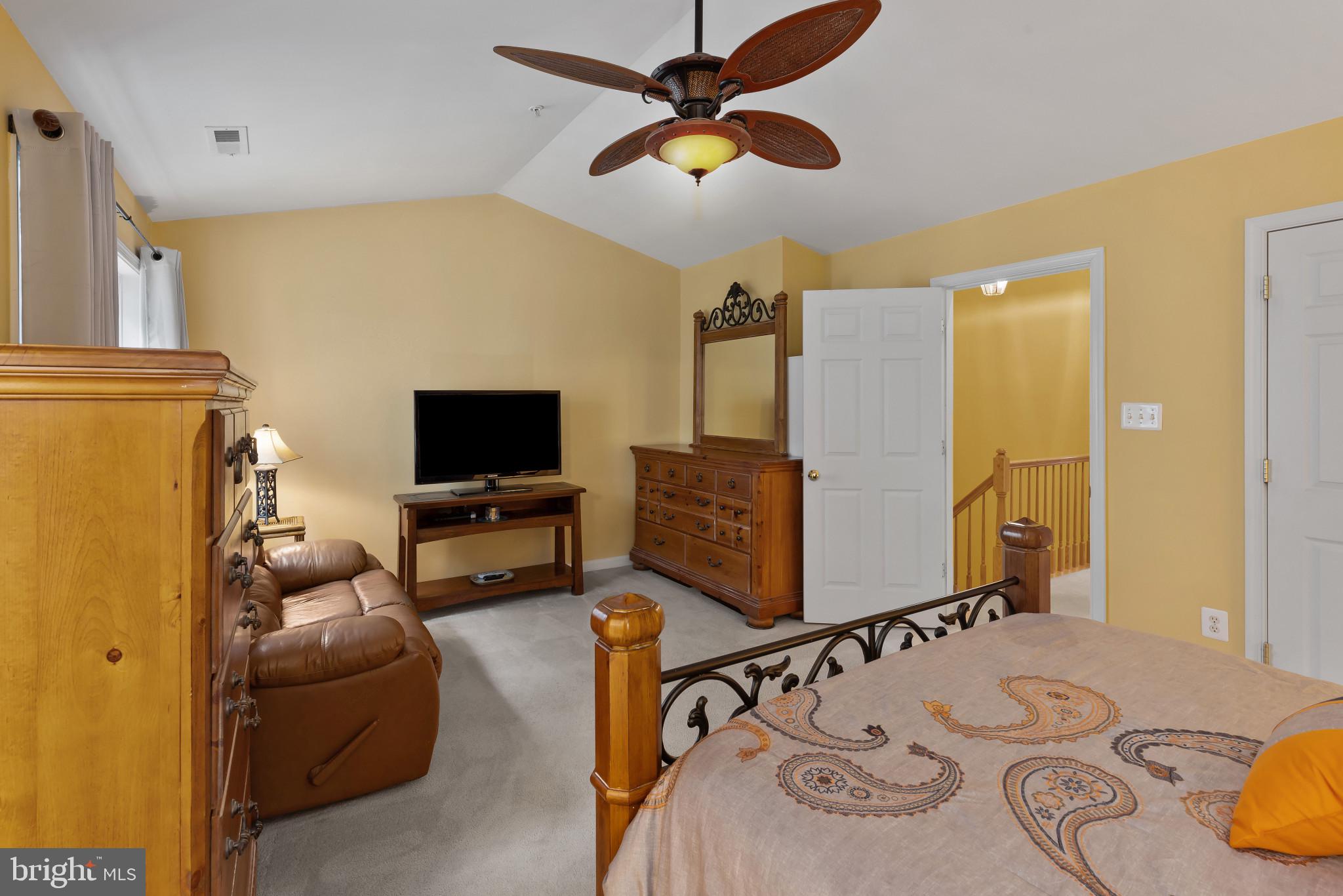 2433 Killarney Terrace Odenton, MD 21113 - Photo 24 of 48 a living room with furniture and a flat screen tv