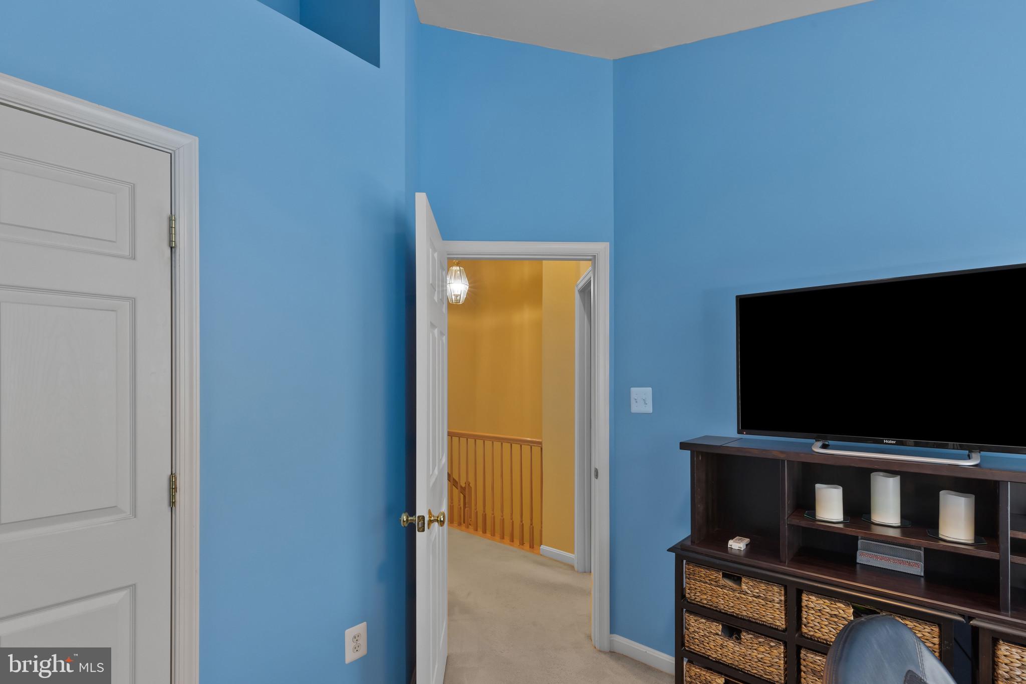 2433 Killarney Terrace Odenton, MD 21113 - Photo 29 of 48 a living room with chair and a flat screen tv