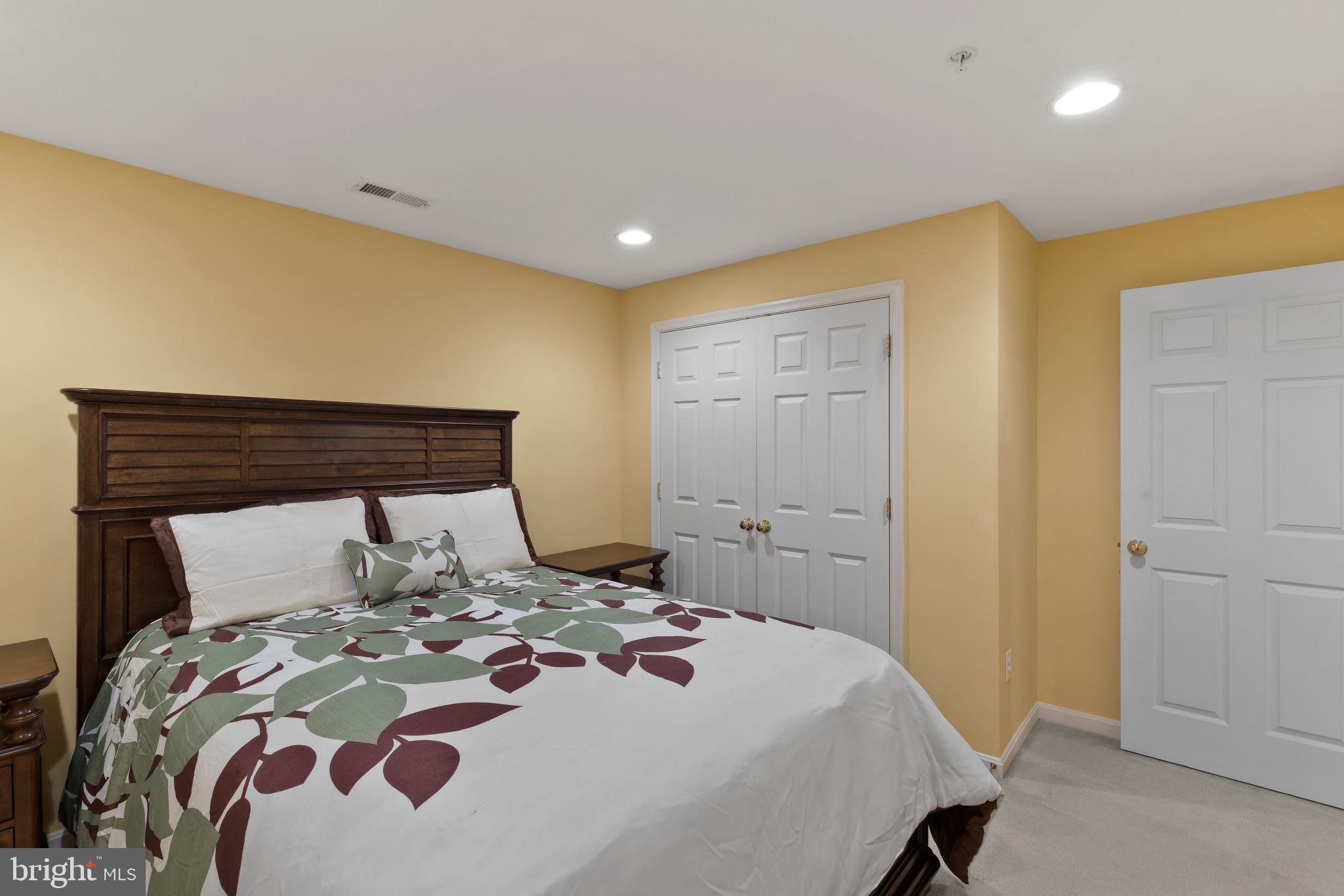 2433 Killarney Terrace Odenton, MD 21113 - Photo 34 of 48 a bedroom with a bed and a dresser