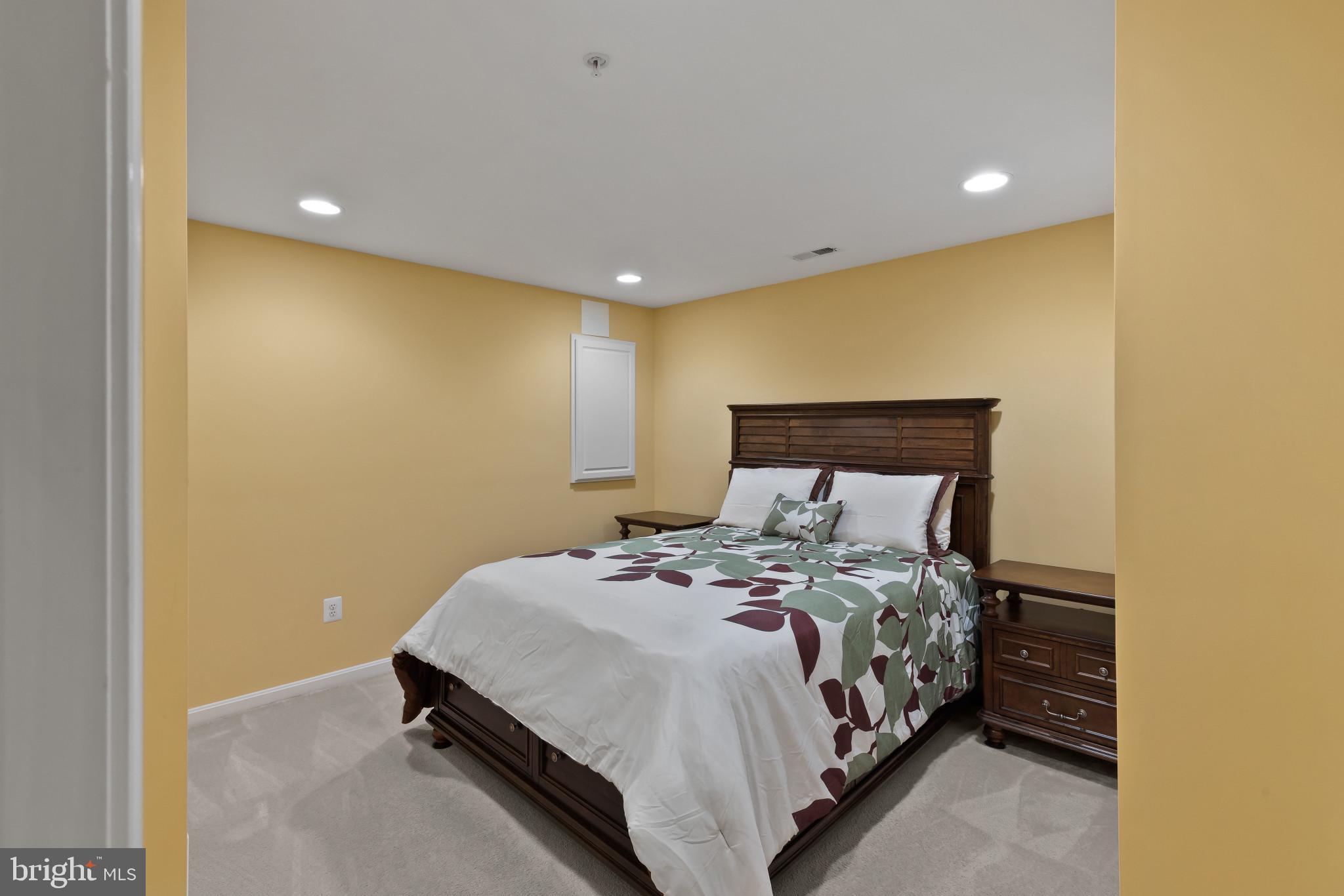 2433 Killarney Terrace Odenton, MD 21113 - Photo 35 of 48 a large bed sitting in a room next to a wall