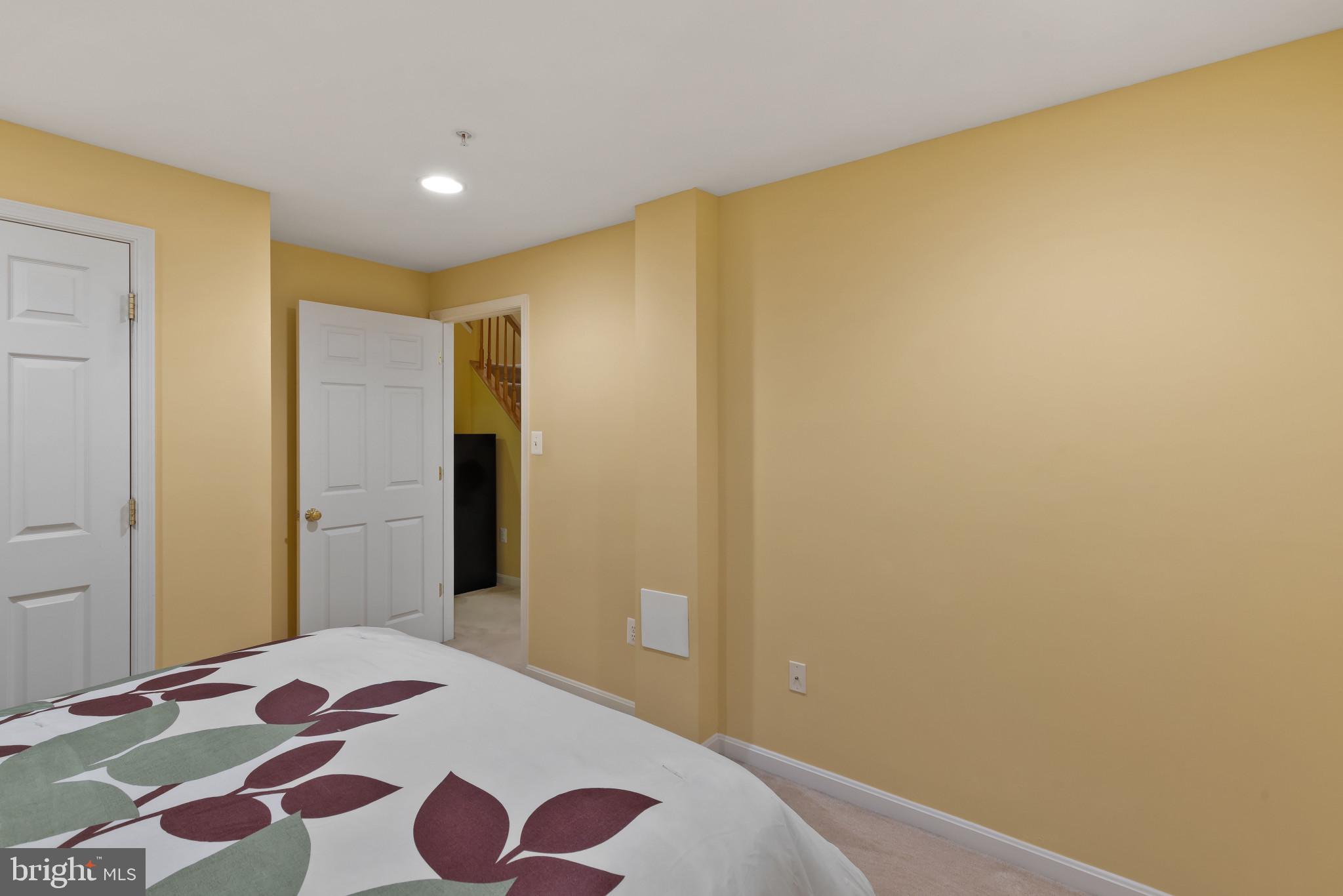 2433 Killarney Terrace Odenton, MD 21113 - Photo 36 of 48 a bedroom with a bed and wooden floor