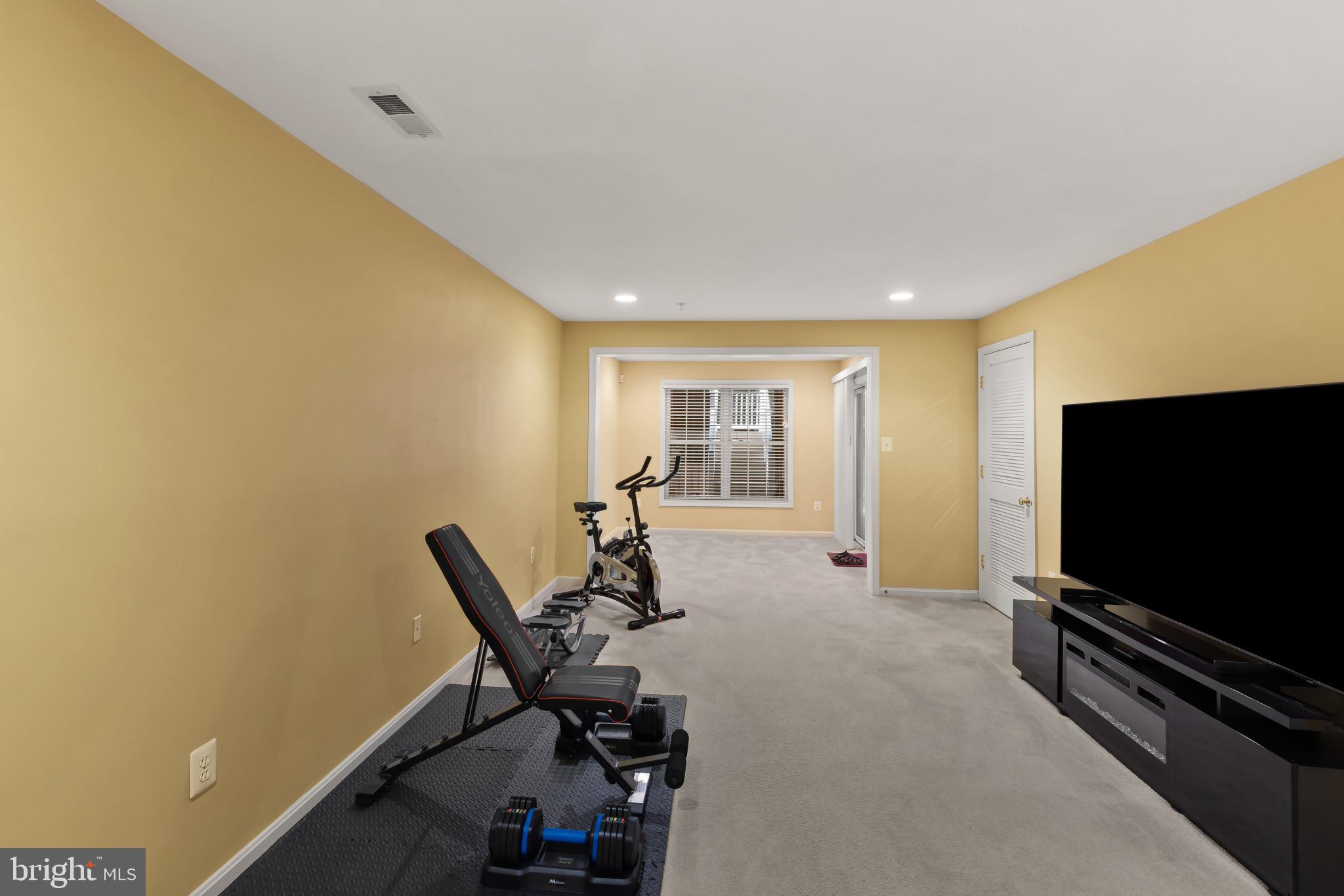 2433 Killarney Terrace Odenton, MD 21113 - Photo 38 of 48 a living room with furniture and a flat screen tv