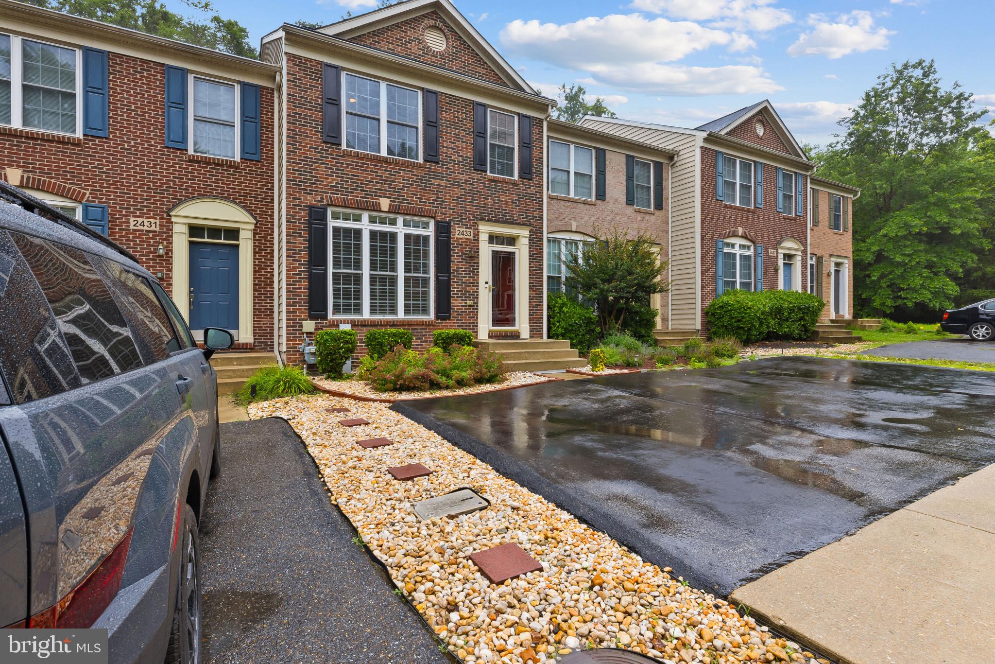 2433 Killarney Terrace Odenton, MD 21113 - Photo 47 of 48 a view of a brick building next to a yard