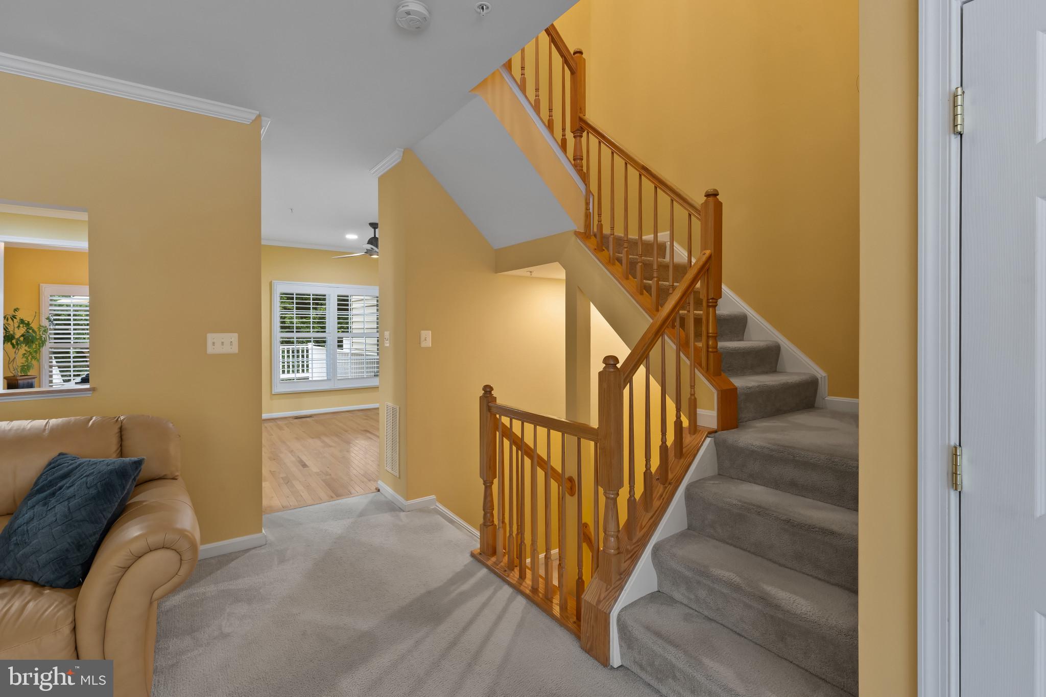 2433 Killarney Terrace Odenton, MD 21113 - Photo 6 of 48 a view of a livingroom with wooden floor and stairs
