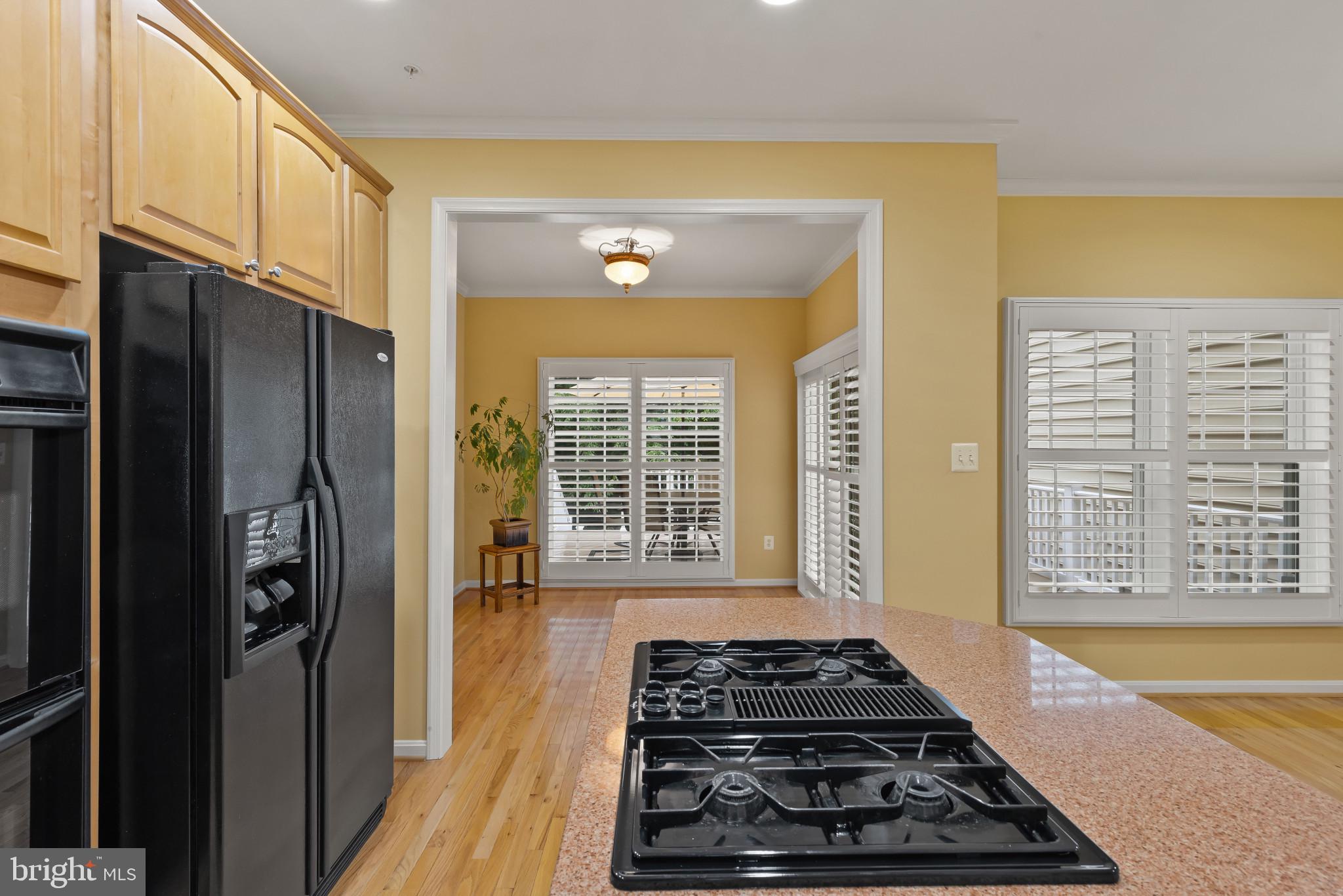 2433 Killarney Terrace Odenton, MD 21113 - Photo 10 of 48 a kitchen with stainless steel appliances granite countertop a stove and a refrigerator