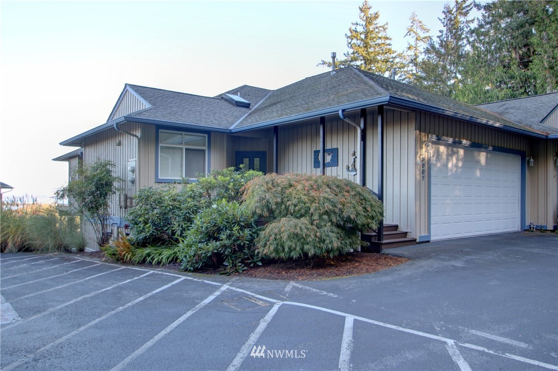 3907 Ridgetop Anacortes, WA 98221 - Photo 2 of 23 a front view of a house with a garden