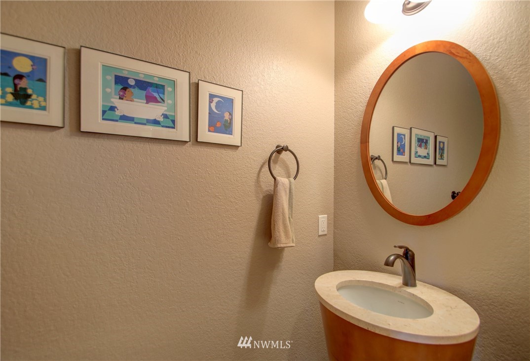 3907 Ridgetop Anacortes, WA 98221 - Photo 11 of 23 a bathroom with a sink and mirror