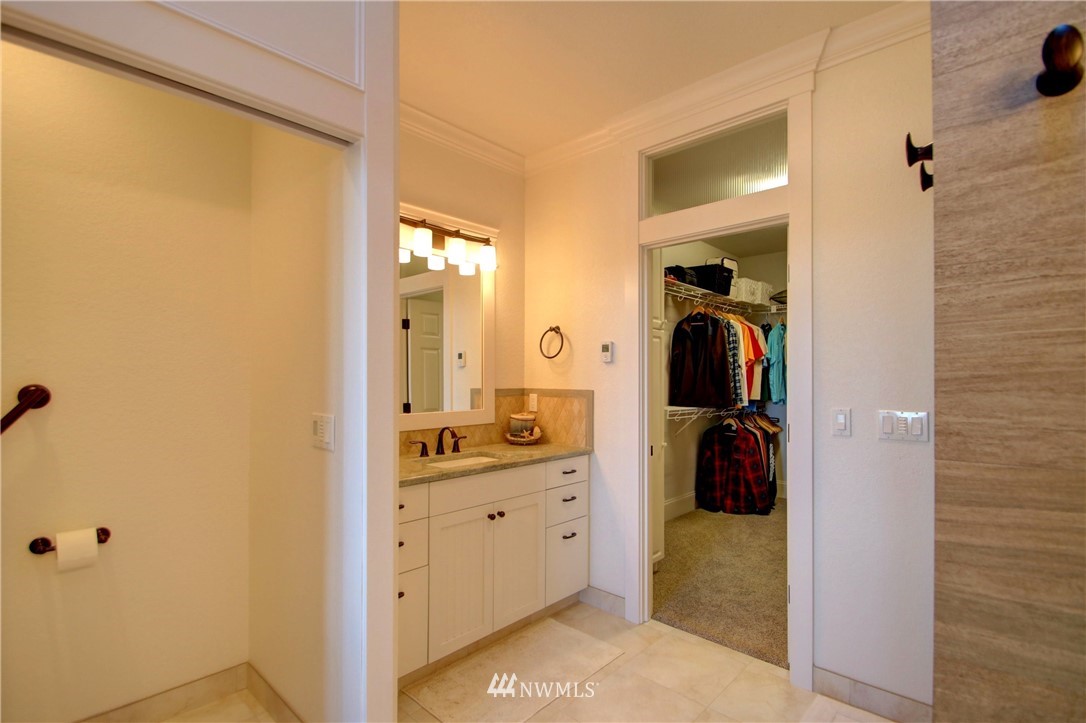 3907 Ridgetop Anacortes, WA 98221 - Photo 14 of 23 a en suite bathroom with a sink and a mirror