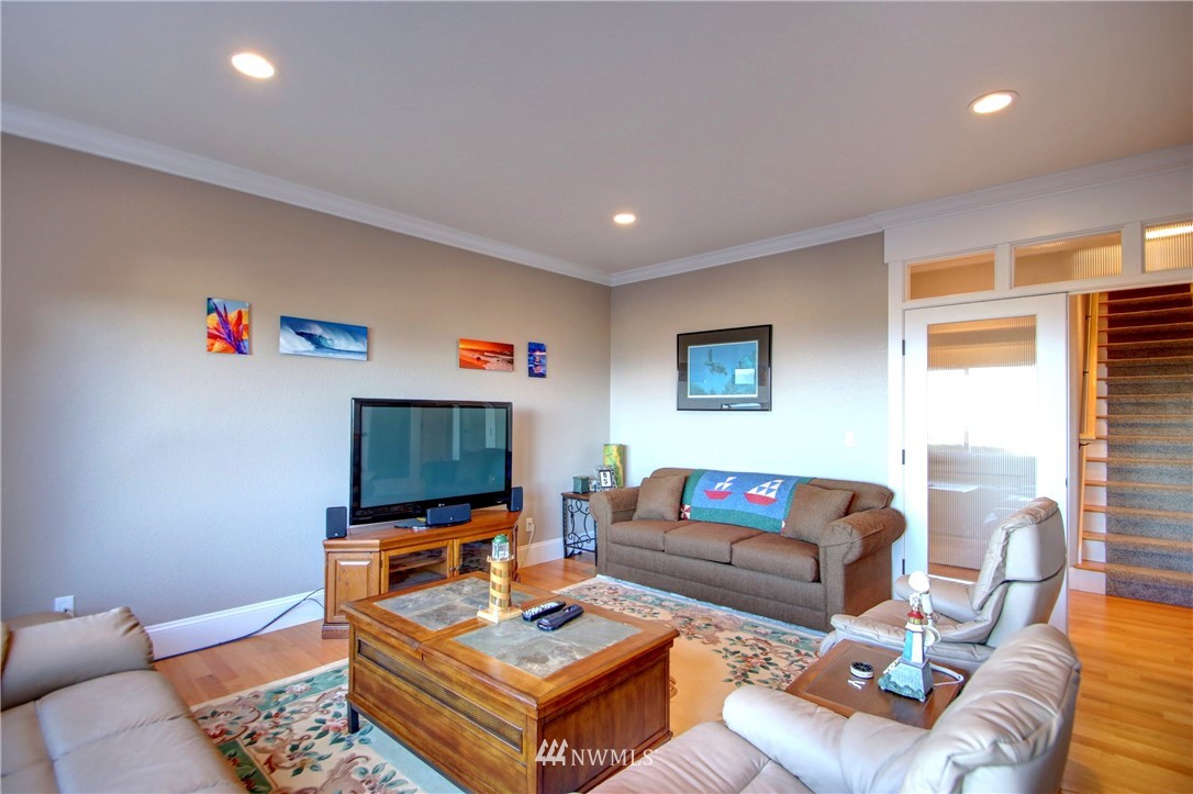 3907 Ridgetop Anacortes, WA 98221 - Photo 15 of 23 a living room with furniture and a flat screen tv
