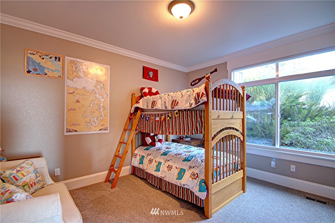 3907 Ridgetop Anacortes, WA 98221 - Photo 16 of 23 a bedroom with a bed and a window
