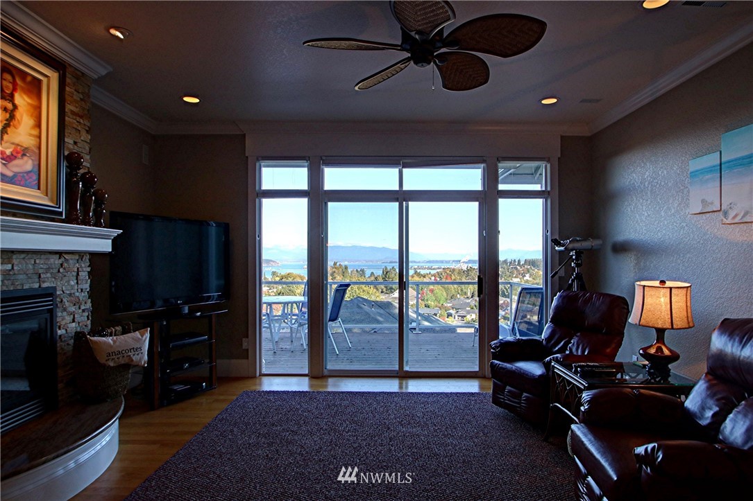 3907 Ridgetop Anacortes, WA 98221 - Photo 19 of 23 a living room with furniture and a fireplace