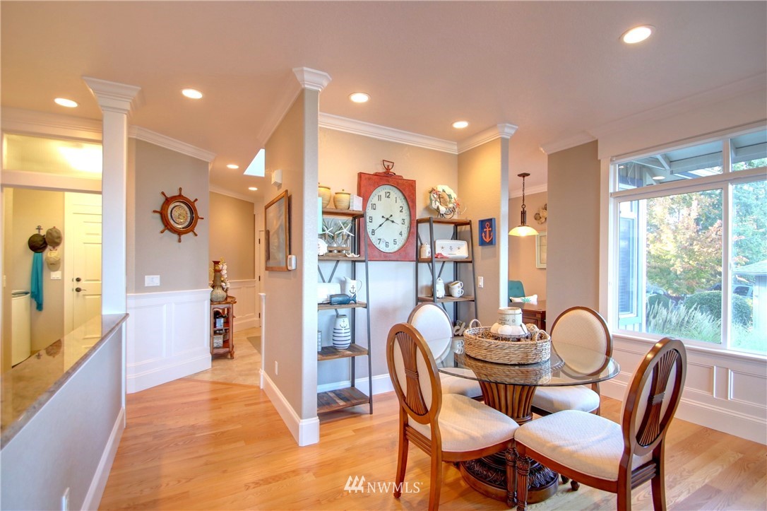 3907 Ridgetop Anacortes, WA 98221 - Photo 7 of 23 a dining room with furniture and a large window